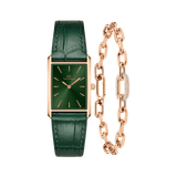 Rectangular rose gold watch with an emerald green sunray dial and crocodile-embossed green leather strap, paired with a matching rose gold crystal link bracelet featuring bold chain links and a sparkling crystal centrepiece.