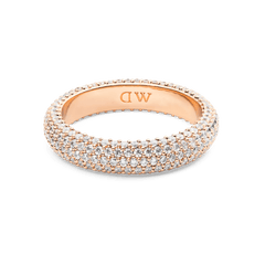 Rose gold pavé ring with a 5 mm band, set with rows of sparkling white cubic zirconia crystals and finished with subtle DW branding inside the band.
