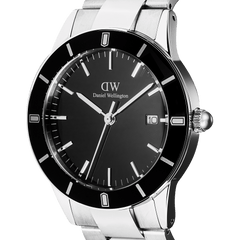 Close-up of the Daniel Wellington Iconic Paradigma Link Black Enamel watch, highlighting its black enamel dial, bold index bezel, date window, and polished stainless steel case and bracelet.