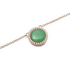 Close-up of Audrey Necklace Jade Rose Gold featuring a domed green jade charm with cubic zirconia on a rose gold chain.