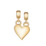Polished gold split heart charm with an organic wave design, featuring two loops for wearing together or separately as a necklace or bracelet accessory.
