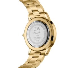 Back view of the Steven Harrington x Daniel Wellington gold watch, showing the engraved caseback with collaboration branding, unique serial number, and polished gold link strap. This limited edition design highlights its exclusivity and premium craftsmanship.
