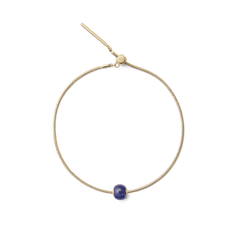 Gold snake chain bracelet featuring the Blue Spot Orb Gold Charm, with a rounded semi-precious blue stone and gold-tone stainless steel accents.