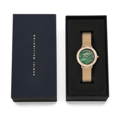 Crystalline Bezel Evergold Green gold mesh watch with green mother-of-pearl dial, presented in a Daniel Wellington gift box.