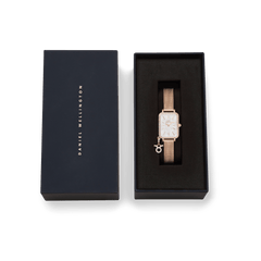 Quadro Crystal Zodiac Melrose rose gold watch with a rectangular mother of pearl dial and crystal bezel, presented in an elegant Daniel Wellington gift box.