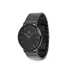 Classic Piano Link Onyx Unitone men’s watch with a brushed black dial, minimalist markers, and a geometric stainless steel piano link strap in a sleek angled view.
