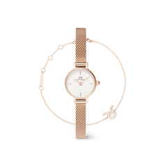 Petite rose gold watch with a slim mesh strap and minimalist white dial, paired with a delicate rose gold chain bracelet featuring a sparkling zodiac charm.