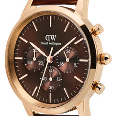 Close-up of the Iconic Chronograph St Mawes Amber RG watch, highlighting its rose gold case, amber sunray dial with three chronograph sub-dials, and minimalist hour markers.