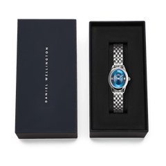 Ophelia Mini Arctic Silver women’s watch with blue dial and silver bracelet, presented in a Daniel Wellington gift box.