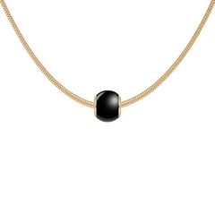 Black Orb Charm G in smooth black ceramic with gold PVD-plated stainless steel accents, elegantly styled on a gold snake chain necklace for a modern, sophisticated look.