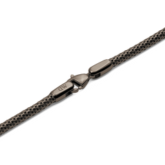 Detail of the Tide Mesh Necklace Graphite 2.8 showing the elegant graphite lobster clasp and fine stainless steel mesh chain with a subtle sheen.