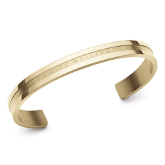 Daniel Wellington Elan Bracelet Gold shown from an angled view, highlighting its polished gold PVD finish, minimalist open cuff design, and engraved branding along the outer edge.
