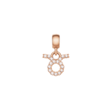 Taurus zodiac charm in rose gold stainless steel, featuring a circular symbol adorned with sparkling cubic zirconia crystals.