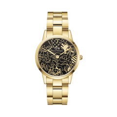 Gold stainless steel watch with a polished link strap and a black dial featuring Steven Harrington’s playful illustrations, blending artistic flair with classic Daniel Wellington design.