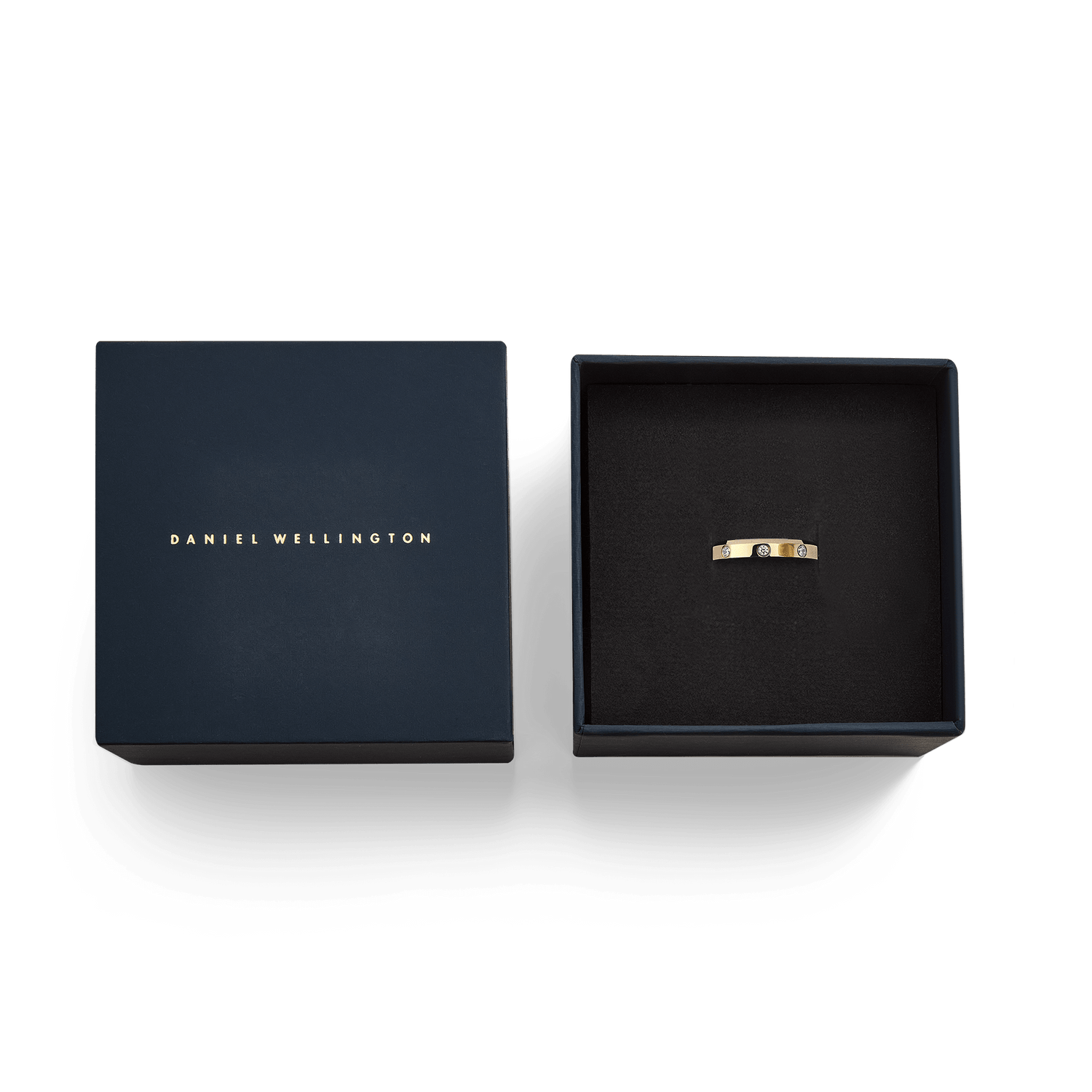 Classic Lumine Ring Gold 4 mm with cubic zirconia stones, elegantly presented in a navy blue Daniel Wellington gift box.