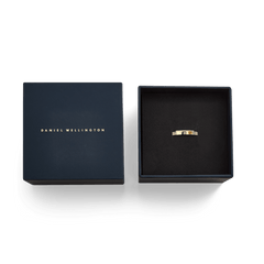 Classic Lumine Ring Gold 4 mm with cubic zirconia stones, elegantly presented in a navy blue Daniel Wellington gift box.