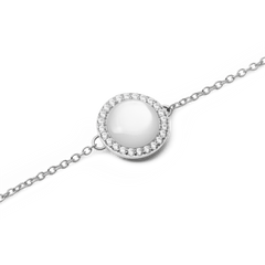Close-up of Audrey Bracelet Mother of Pearl Silver featuring a domed pearl charm with cubic zirconia halo on a fine silver chain.