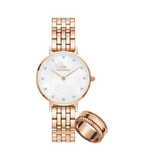 Rose gold women’s watch with a mother of pearl dial and crystal hour markers, paired with a matching rose gold Elevation Ring featuring intricate detailing.