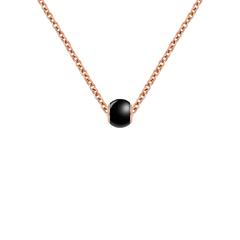 Rose gold chain necklace featuring a smooth black ceramic orb charm with polished rose gold plated edges, offering a modern and elegant look.