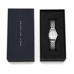 Ophelia Mini Silver women’s watch with oval case and 5-link bracelet, presented in a navy Daniel Wellington gift box.