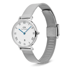 Petite Roman Numerals Date Silver watch featuring a polished stainless steel mesh strap, white dial with Roman numerals, blue hands, guilloché detailing, and a date window at six o’clock.