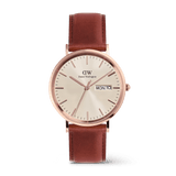 Classic Day Display St Mawes Rose Gold Champagne men’s watch featuring a champagne dial with a subtle triangle pattern, rose gold round case, day and date window, and a brown leather strap with pin buckle.