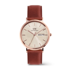 Classic Day Display St Mawes Rose Gold Champagne men’s watch featuring a champagne dial with a subtle triangle pattern, rose gold round case, day and date window, and a brown leather strap with pin buckle.