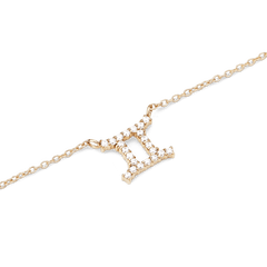 Close-up of the Crystal Zodiac Chain Necklace Gold featuring a Gemini pendant adorned with sparkling hand-set crystals on a fine gold-plated chain.