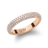 Rose gold pavé crystal ring featuring multiple rows of sparkling cubic zirconia set in a claw setting, with a polished inner band engraved with the Daniel Wellington signature.