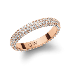 Rose gold pavé crystal ring featuring multiple rows of sparkling cubic zirconia set in a claw setting, with a polished inner band engraved with the Daniel Wellington signature.