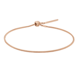 Slender rose gold snake chain bracelet with an adjustable sliding clasp, crafted from stainless steel and finished with a polished, minimalist design ideal for layering or wearing alone.