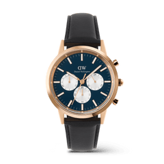 Men’s chronograph watch featuring a deep blue dial with white sub-dials, rose gold case, and black leather strap, showcasing the Iconic Chronograph Sheffield Arctic Panda Rose Gold by Daniel Wellington.