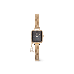 Gold rectangular women’s watch with a black mother of pearl dial, crystal-set bezel, gold mesh strap, and a sparkling zodiac charm attached, designed for a refined and personalised look.