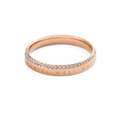Classic Aura Ring Rose Gold with a slim rose gold band, Daniel Wellington engraving, and a row of sparkling white cubic zirconia crystals along the edge for an elegant, modern finish.