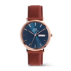 Classic Day Display St Mawes Rose Gold Arctic men’s watch featuring a textured blue dial with day and date display, rose gold stainless steel case, and a brown leather strap with pin buckle.