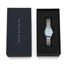 Ophelia Mini Ice Blue Silver women’s watch with oval case and silver strap, presented in a Daniel Wellington gift box.