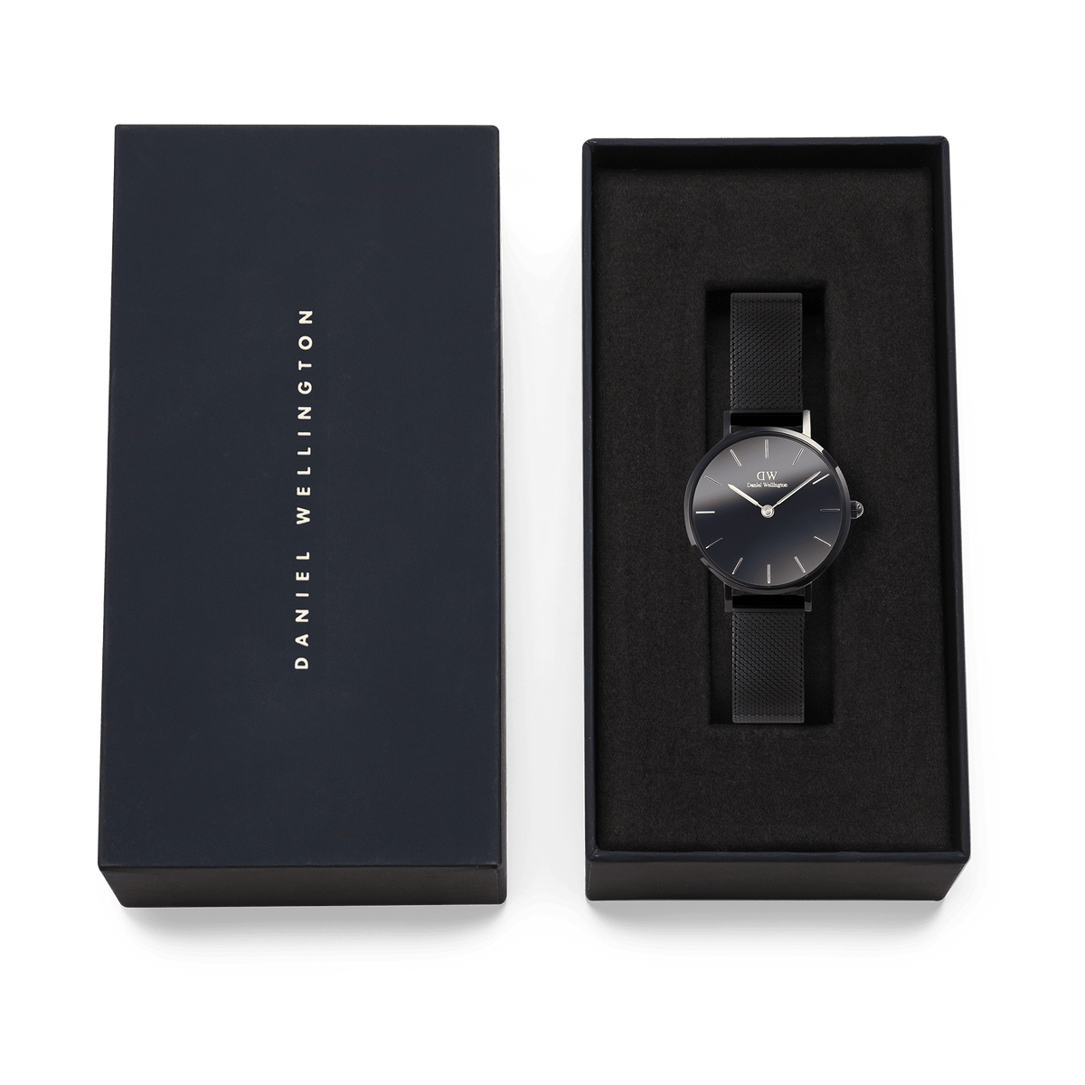 Daniel Wellington Petite Reflection Black watch with a mirror glass dial and black mesh strap, elegantly presented in a branded gift box.