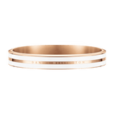 Rose gold bracelet with a satin white enamel inlay and Daniel Wellington engraving, featuring a smooth, contemporary bangle style.
