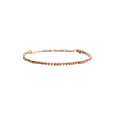 Slim rose gold tennis bracelet featuring a row of apricot-coloured Preciosa crystals, with an adjustable chain and secure lobster clasp for a refined, elegant finish.