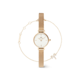Gold mesh strap petite watch with a minimalist white dial, paired with a delicate gold bracelet featuring a zodiac motif and adjustable chain, displayed as a coordinated jewellery set.