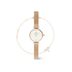 Gold mesh strap petite watch with a minimalist white dial, paired with a delicate gold bracelet featuring a zodiac motif and adjustable chain, displayed as a coordinated jewellery set.