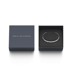 Classic Lumine Bracelet S presented in an elegant Daniel Wellington gift box, featuring a slim silver cuff with sparkling crystals and engraved detailing.