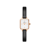 Rectangular rose gold women’s watch with a white dial and slim black leather strap, featuring minimalist hour markers and a petite, elegant design.