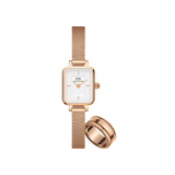 Rectangular Daniel Wellington Quadro Mini Melrose watch with a white dial and rose gold mesh strap, paired with a matching rose gold Elevation ring featuring a textured edge.