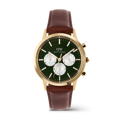 Gold chronograph watch with an emerald green dial, white sub-dials, and a brown leather strap, featuring gold-tone detailing and a classic design by Daniel Wellington.