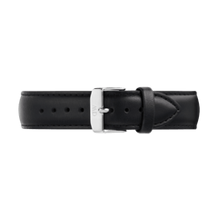 Black leather watch strap with a tapered design, detailed stitching, and a polished silver 316L stainless steel pin buckle, shown laid flat to highlight its sleek profile and refined finish.