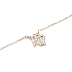 Gold chain necklace featuring a Virgo zodiac pendant adorned with sparkling hand-set crystals.