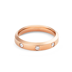 Classic Lumine Ring in rose gold with a 4mm band, featuring three bezel-set cubic zirconia crystals and a smooth, polished finish.