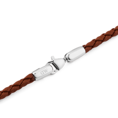 Detail view of the Daniel Braided Leather Bracelet St Mawes 2.8 Silver, highlighting the brown braided leather band and polished silver stainless steel lobster clasp engraved with the DW logo.