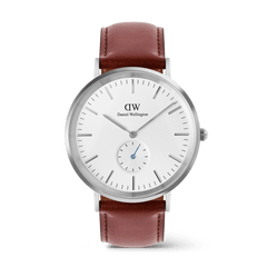 Classic men’s watch with an off-white sunray dial featuring a subtle triangular pattern, a blue-tipped sub-second hand, silver stainless steel case, and a brown leather strap.